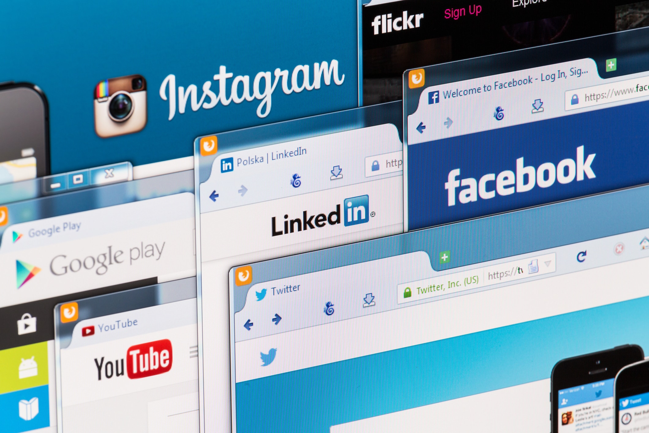 Multiple browser tabs showcase popular social media platforms, including Instagram, Facebook, LinkedIn, YouTube, and Twitter, symbolizing digital connectivity.