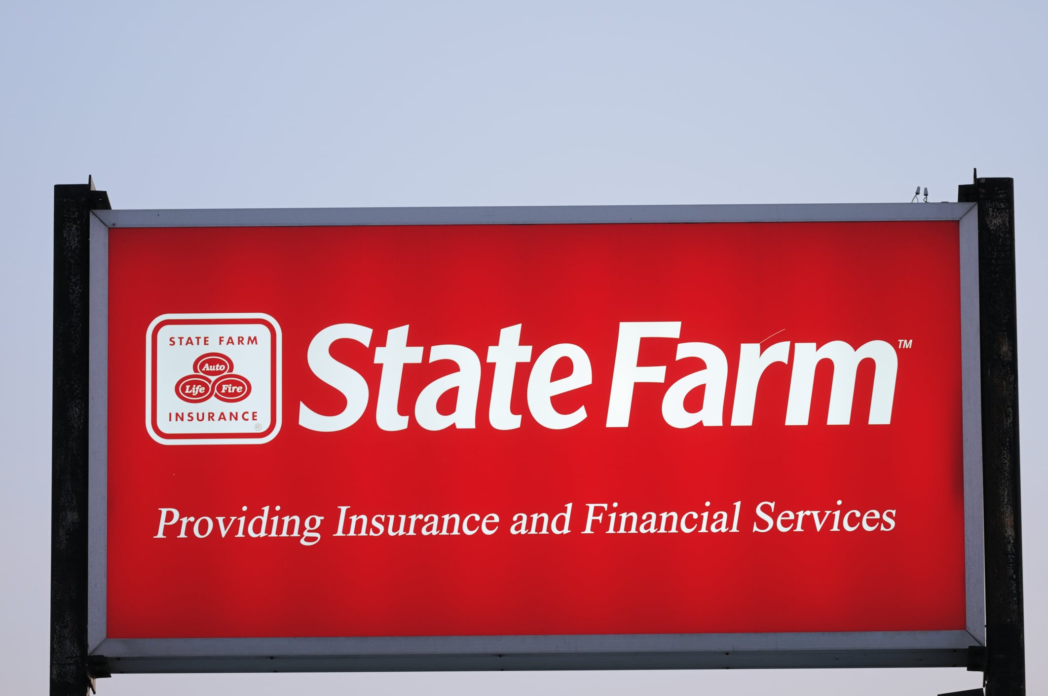 A large red and white sign displaying the State Farm logo and name prominently.
