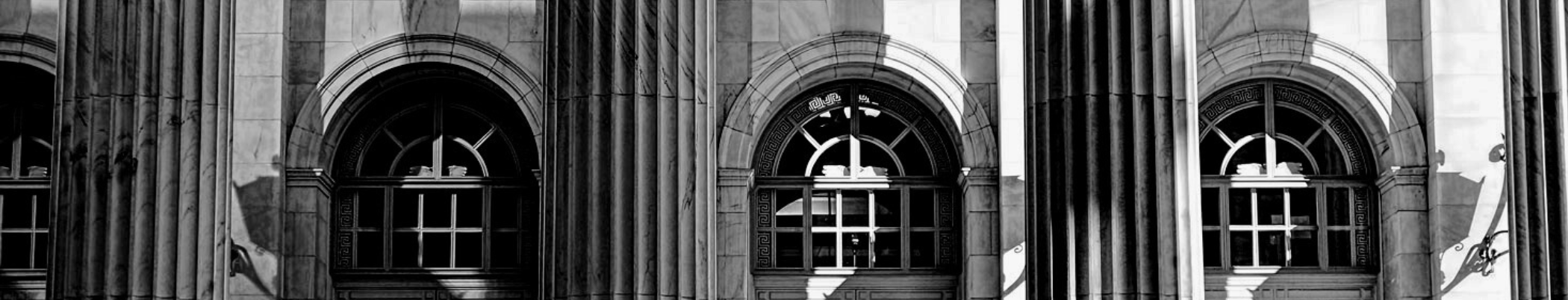 Building façade with columns in grayscale.