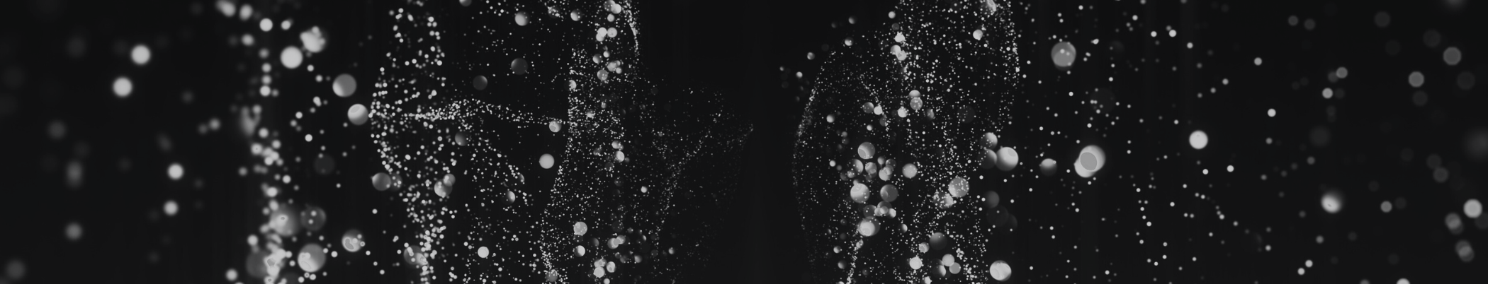 Dark abstract starry or particle-style background image.
