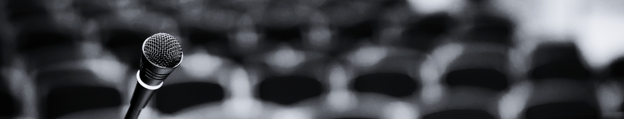 Dark abstract image with blurred circular highlights.