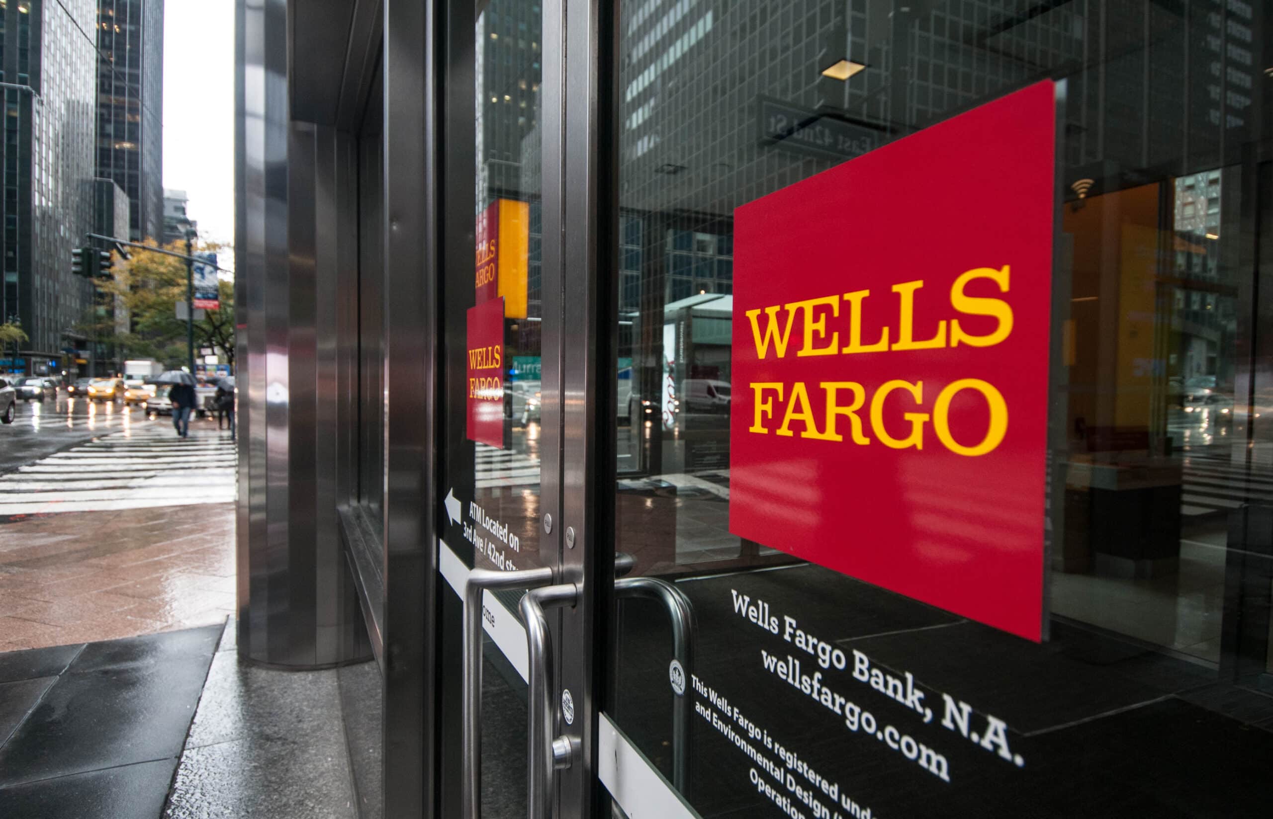 Wells Fargo signage reflected in glass window.
