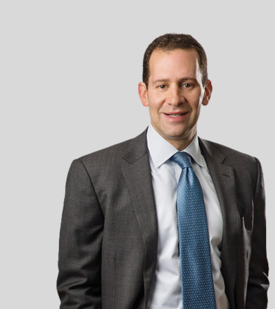 Joseph H. Meltzer Professional headshot of male attorney in gray suit and blue tie.