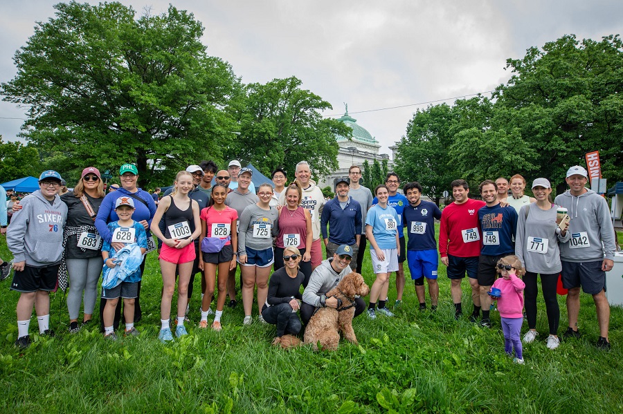 Group photo outdoors with volunteers or team members.