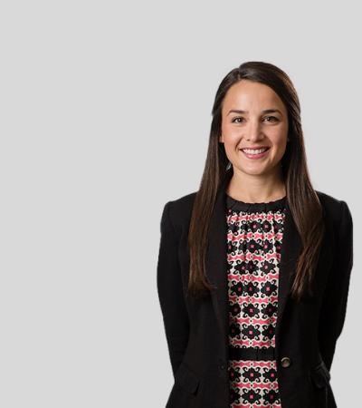Stefanie J. Menzano: Studio portrait of a woman in patterned top and blazer