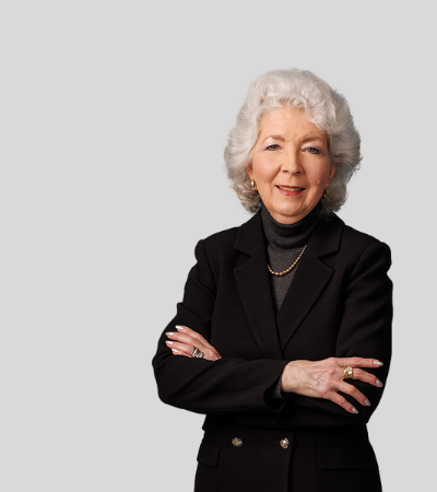 Candice L.H. Hegedus: Studio portrait of an older woman with gray hair wearing black blazer