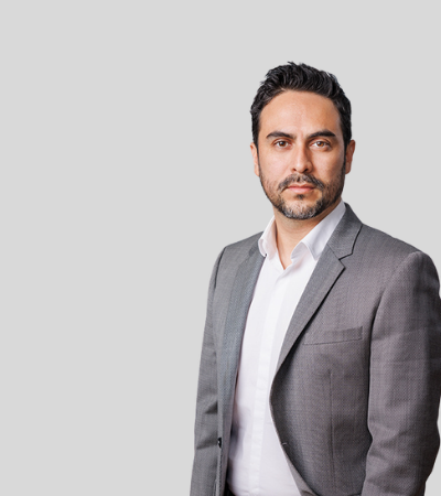 Juan Pablo Villatoro: Studio portrait of a man with dark hair and trimmed beard