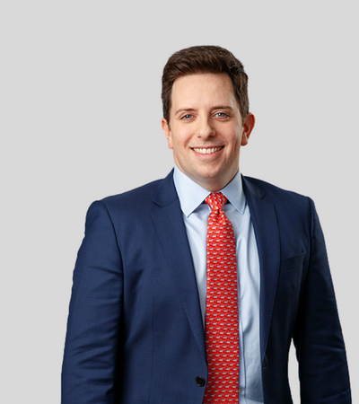 Ian Yeates: Studio portrait of a man in blue suit smiling
