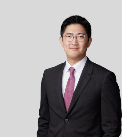 Alex Park: Studio portrait of a man in black suit with red tie