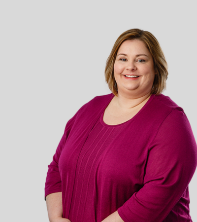 Jean Chuba: Studio portrait of a woman wearing a magenta top