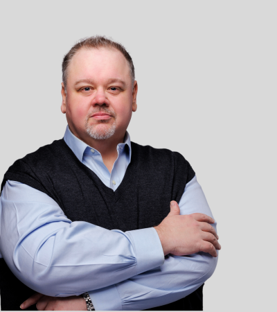 Justin Chaney: Studio portrait of a man in dark jacket