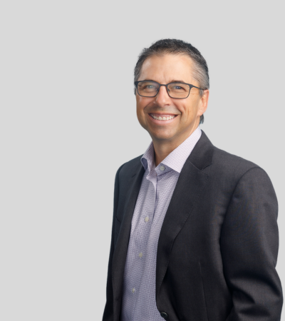 David Kessler Bioimage Man with glasses in gray blazer, smiling.