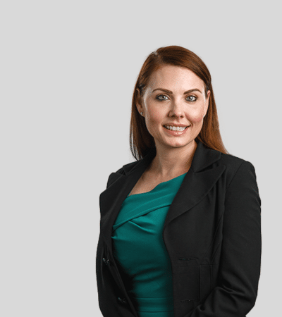 Melissa L. Yeates: Studio portrait of a woman in blazer smiling