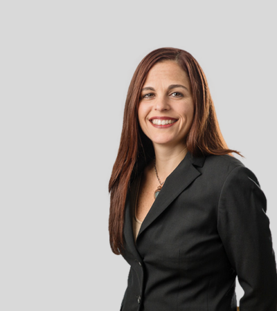 Robin Winchester image Woman with long brown hair, black blazer, smiling.