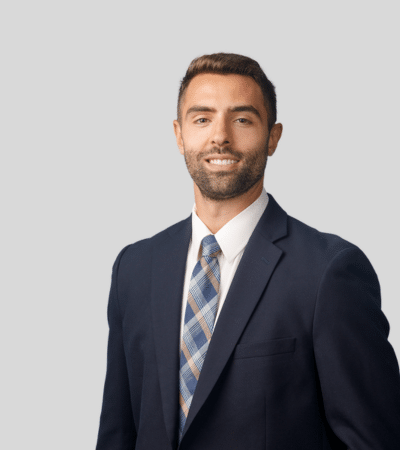Jonathan Naji bioimage: Studio portrait of a man in suit with patterned tie