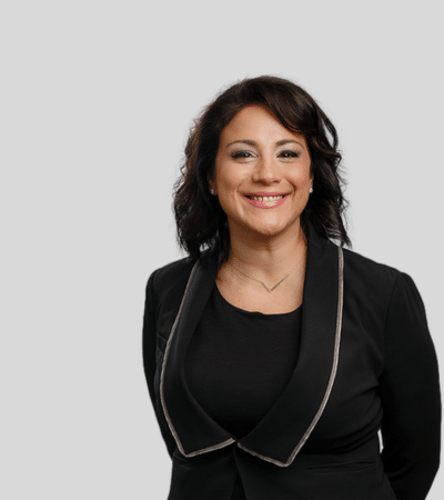 Lisa Lamb Port: Studio portrait of a woman in black blazer smiling