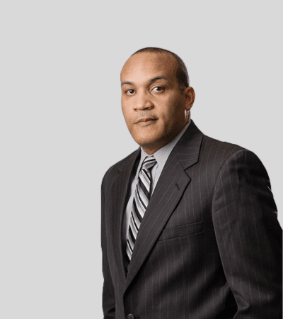 LaMarlon R. Barksdale: Studio portrait of a man in dark suit and striped tie