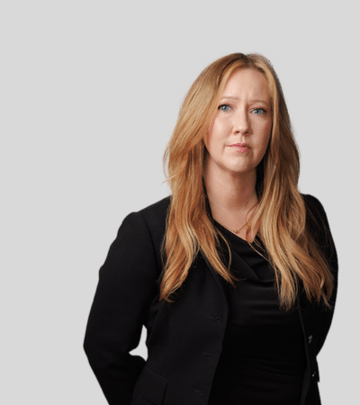 Erin E. Stevens: Studio portrait of a woman with long hair wearing black top