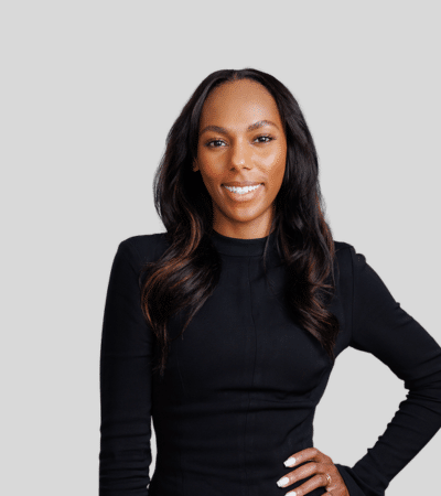 Gabriella N. Igboko: Studio portrait of a woman in black outfit with hand on hip