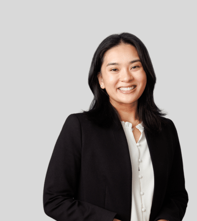 Marianne Uy: Studio portrait of a woman in black blazer smiling