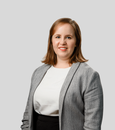 Karissa J. Sauder Bioimagw: Studio portrait of a woman in gray blazer smiling